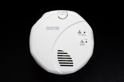 Close-up of a carbon monoxide (CO) detector on a black background