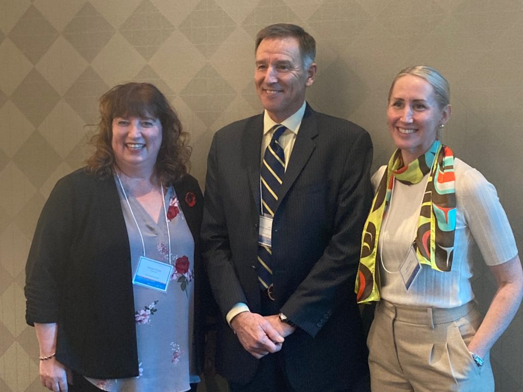 A photo of Conference co-chairs Pamela Fuselli, Dr. Ian Pike of BCIRPU (and a board director for Parachute) and Megan Oakey, Provincial Manager, Injury Prevention, Population & Public Health, BC Centre For Disease Control.