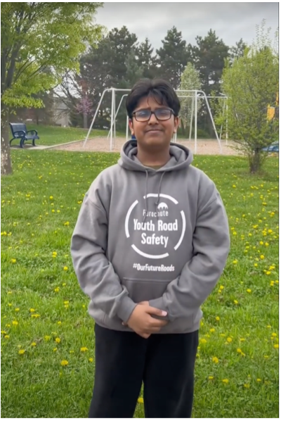 Photo of Raj Sagar in a grey Youth Road Safety hoodie