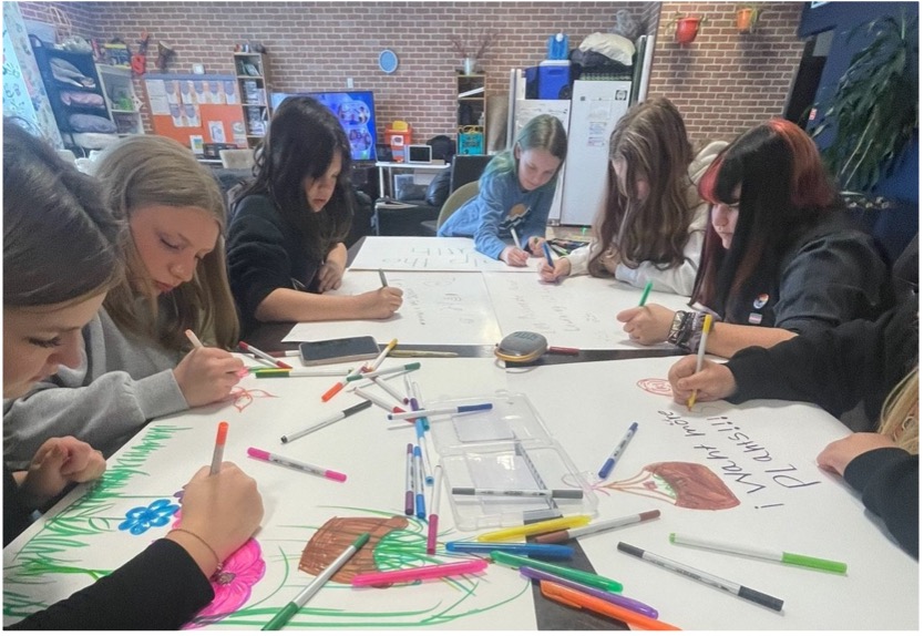 Photo of project members working at a table