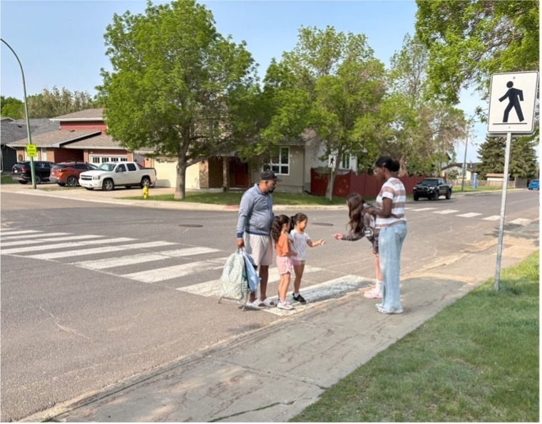 Photo of people in crosswalk