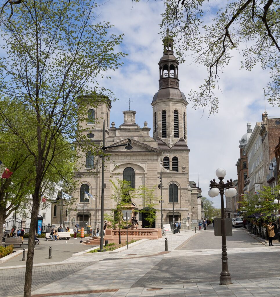 View acros place de l’Hôtel-de-Ville in Quebec City with church in background